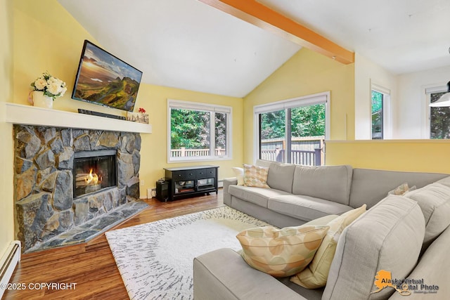 2003 Jamestown Cir, Anchorage, AK 99507 - living room featuring healthy amount of natural light, wood finished floors, a fireplace, and a baseboard heating unit