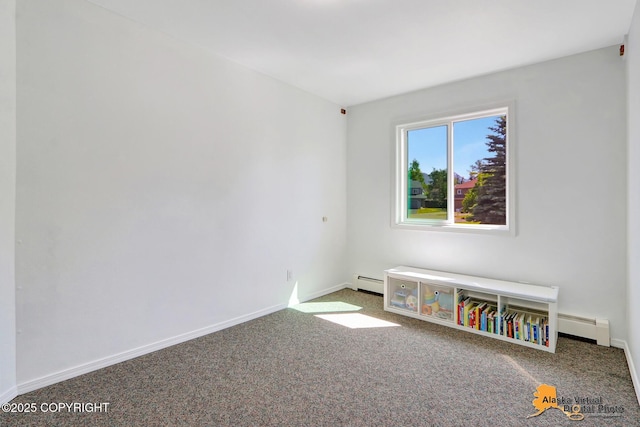 2003 Jamestown Cir, Anchorage, AK 99507 - carpeted empty room with a baseboard heating unit