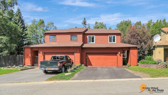 2003 Jamestown Cir, Anchorage, AK 99507 - view of front of house with driveway, a garage, and roof with shingles