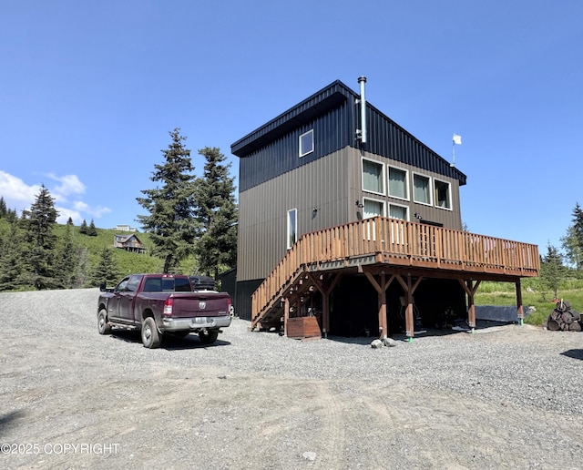 36339 Maria Rd, Homer, AK 99603 - view of front of house featuring gravel driveway, a deck, and stairway