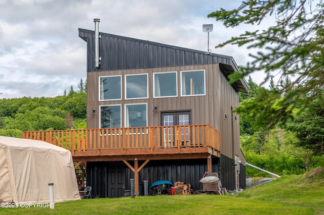 36339 Maria Rd, Homer, AK 99603 - back of property featuring a wooden deck, french doors, board and batten siding, and a yard