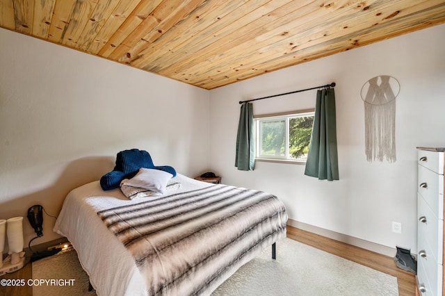 36339 Maria Rd, Homer, AK 99603 - bedroom with wooden ceiling and wood finished floors