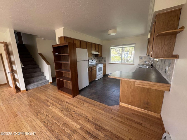 705 W Fairview Ave, Homer, AK 99603 - kitchen with open shelves, white appliances, a sink, backsplash, and a textured ceiling