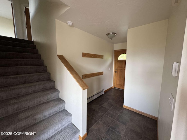 705 W Fairview Ave, Homer, AK 99603 - stairs with a baseboard heating unit and baseboards