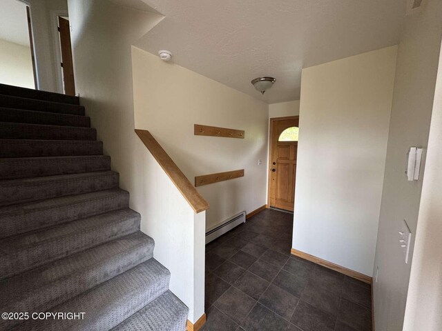 705 W Fairview Ave, Homer, AK 99603 - staircase featuring baseboard heating and baseboards