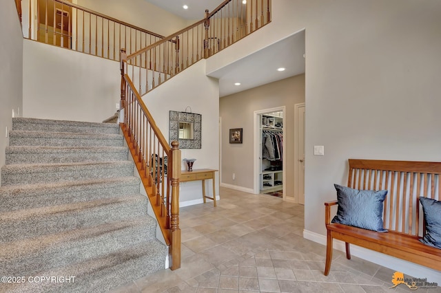 2842 Ensign Dr, Anchorage, AK 99515 - staircase featuring a high ceiling, recessed lighting, and tile patterned floors
