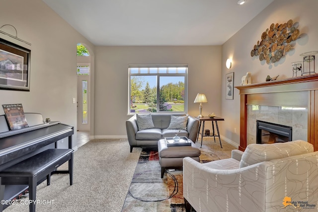 2842 Ensign Dr, Anchorage, AK 99515 - living room featuring healthy amount of natural light, a tiled fireplace, and carpet
