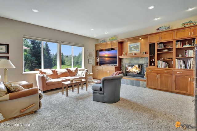 2842 Ensign Dr, Anchorage, AK 99515 - carpeted living area featuring a tiled fireplace and recessed lighting