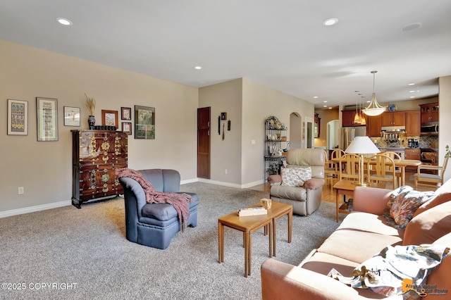 2842 Ensign Dr, Anchorage, AK 99515 - living room with light colored carpet, arched walkways, and recessed lighting