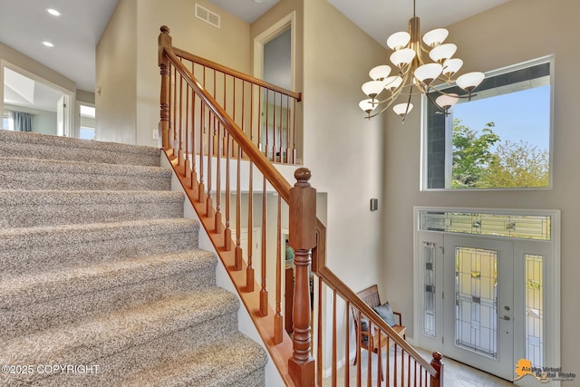 2842 Ensign Dr, Anchorage, AK 99515 - foyer with a chandelier, stairs, recessed lighting, and a towering ceiling