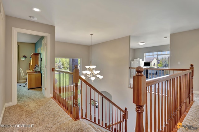 2842 Ensign Dr, Anchorage, AK 99515 - corridor featuring an upstairs landing, a chandelier, carpet flooring, and recessed lighting