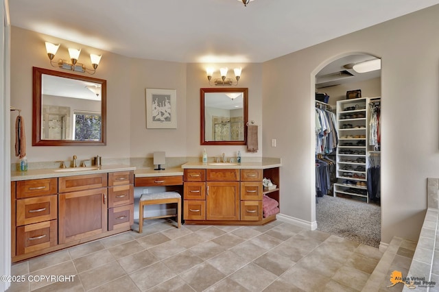 2842 Ensign Dr, Anchorage, AK 99515 - bathroom with vanity, a chandelier, a spacious closet, and tile patterned flooring