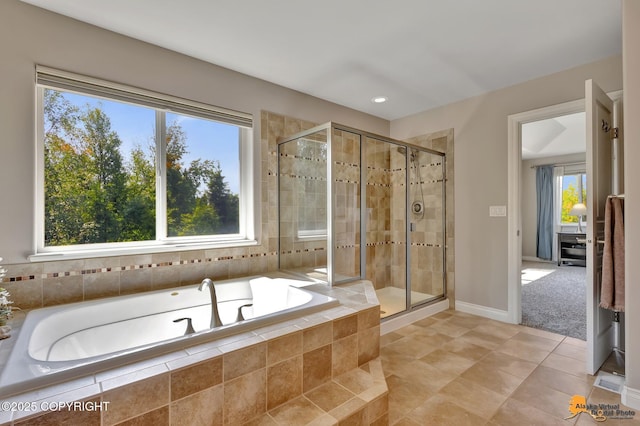 2842 Ensign Dr, Anchorage, AK 99515 - bathroom featuring a bath, a stall shower, tile patterned floors, and recessed lighting