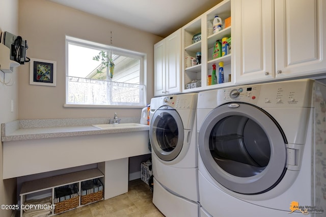 2842 Ensign Dr, Anchorage, AK 99515 - laundry area featuring washing machine and clothes dryer and cabinet space