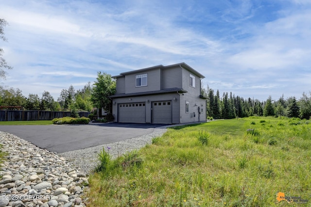 2842 Ensign Dr, Anchorage, AK 99515 - view of side of property featuring an attached garage and driveway
