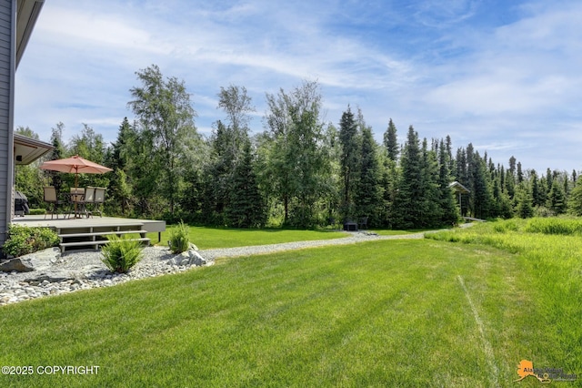 2842 Ensign Dr, Anchorage, AK 99515 - view of grassy yard with a wooded view