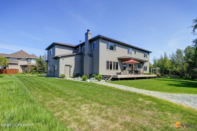 2842 Ensign Dr, Anchorage, AK 99515 - back of house with a chimney, a wooden deck, and a lawn