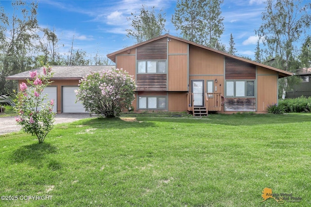 3091 N Longspur Dr, Wasilla, AK 99654 - split level home featuring driveway, a front yard, and an attached garage