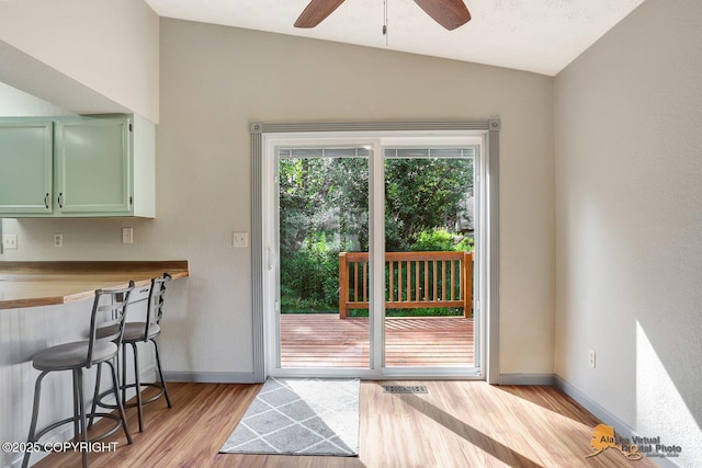 3091 N Longspur Dr, Wasilla, AK 99654 - doorway to outside featuring lofted ceiling, light wood finished floors, and a ceiling fan