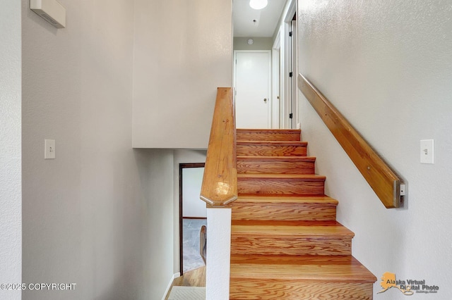 3091 N Longspur Dr, Wasilla, AK 99654 - stairway featuring wood finished floors