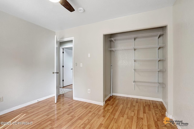 3091 N Longspur Dr, Wasilla, AK 99654 - unfurnished bedroom featuring light wood-type flooring, a closet, and ceiling fan