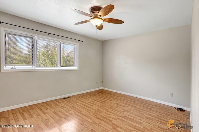 3091 N Longspur Dr, Wasilla, AK 99654 - spare room featuring light wood-style floors and a ceiling fan