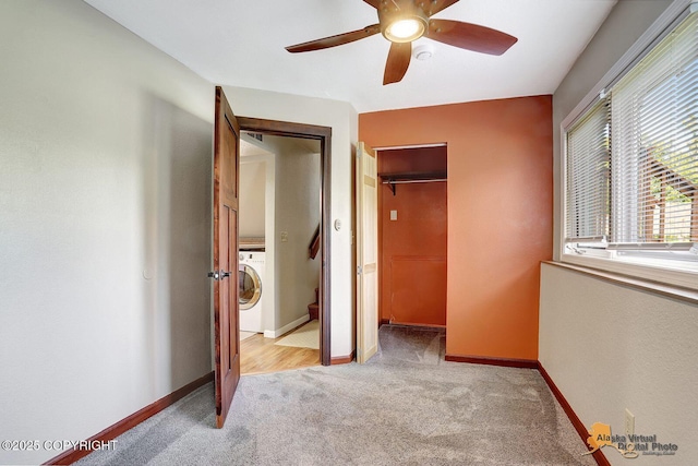 3091 N Longspur Dr, Wasilla, AK 99654 - unfurnished bedroom with washer / clothes dryer, light carpet, a closet, and a ceiling fan
