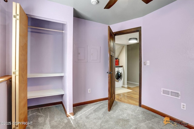 3091 N Longspur Dr, Wasilla, AK 99654 - unfurnished bedroom with washer / dryer, carpet floors, and ceiling fan