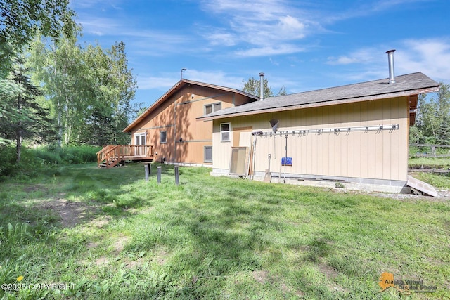 3091 N Longspur Dr, Wasilla, AK 99654 - rear view of property featuring a wooden deck and roof with shingles