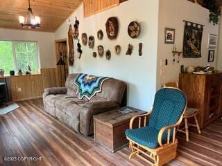 18905 Langille Rd, Cooper Landing, AK 99572 - living area with a wainscoted wall, wood finished floors, lofted ceiling, wood ceiling, and wooden walls