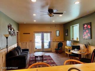 18905 Langille Rd, Cooper Landing, AK 99572 - living area with a wainscoted wall, recessed lighting, ceiling fan, and french doors