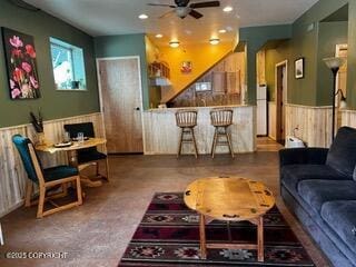 18905 Langille Rd, Cooper Landing, AK 99572 - living room featuring a wainscoted wall, ceiling fan, and recessed lighting