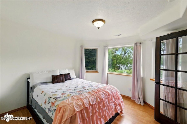 51137 Nanook Cir, Nikiski/North Kenai, AK 99611 - bedroom with baseboards and wood finished floors