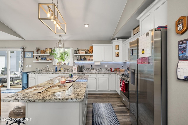 1169 W Trumpeter Swan Dr, Wasilla, AK 99623 - kitchen with stainless steel appliances, open shelves, a sink, white cabinets, and a kitchen island
