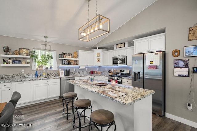 1169 W Trumpeter Swan Dr, Wasilla, AK 99623 - kitchen featuring stainless steel appliances, open shelves, dark wood-type flooring, white cabinetry, and a sink