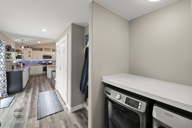 1169 W Trumpeter Swan Dr, Wasilla, AK 99623 - laundry area featuring washing machine and clothes dryer, wood finished floors, baseboards, and recessed lighting