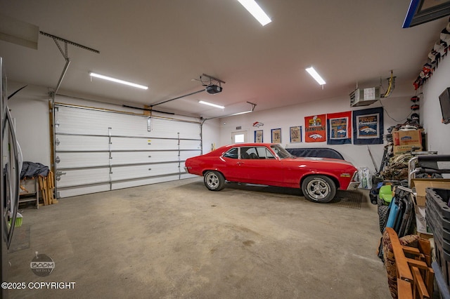 1169 W Trumpeter Swan Dr, Wasilla, AK 99623 - garage with a garage door opener and stainless steel fridge