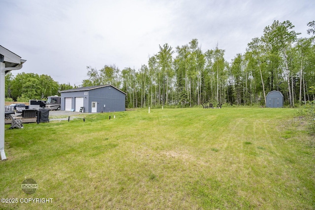 1169 W Trumpeter Swan Dr, Wasilla, AK 99623 - view of green lawn featuring a garage