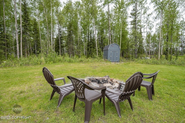 1169 W Trumpeter Swan Dr, Wasilla, AK 99623 - view of grassy yard with an outdoor fire pit