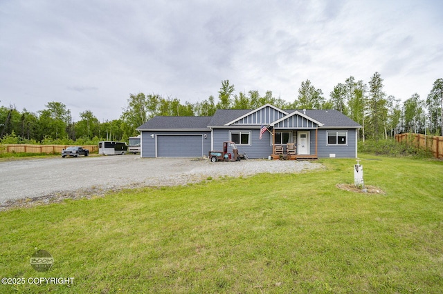 1169 W Trumpeter Swan Dr, Wasilla, AK 99623 - view of front of property with an attached garage, board and batten siding, and driveway
