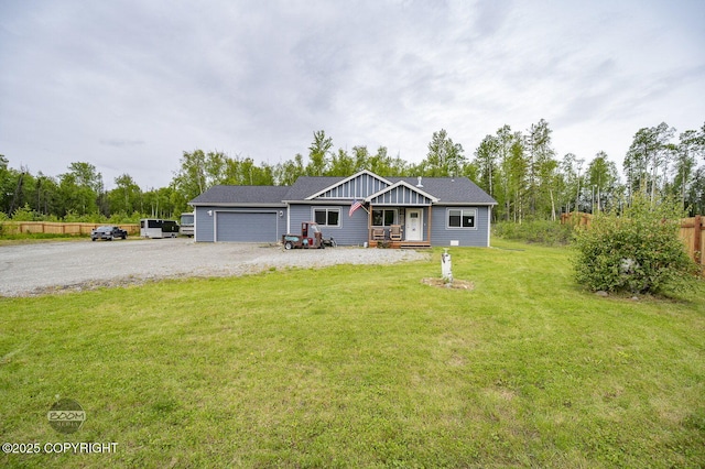 1169 W Trumpeter Swan Dr, Wasilla, AK 99623 - view of front of house with a porch, board and batten siding, a garage, and driveway