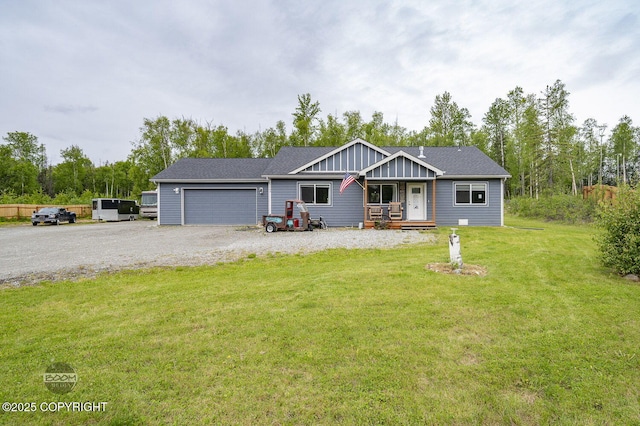 1169 W Trumpeter Swan Dr, Wasilla, AK 99623 - view of front of house with a front yard, an attached garage, and driveway