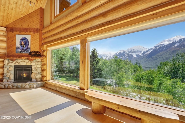 3108 Misty Mountain Rd, Eagle River, AK 99577 - view of patio featuring a stone fireplace and a mountain view