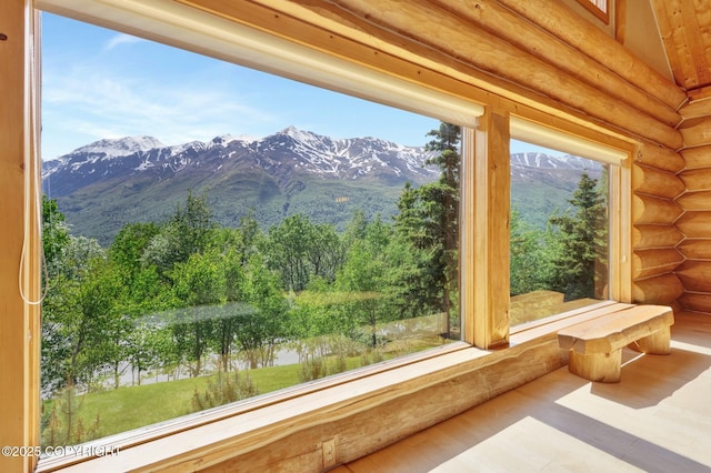 3108 Misty Mountain Rd, Eagle River, AK 99577 - interior space with rustic walls, a mountainous background, and wood finished floors