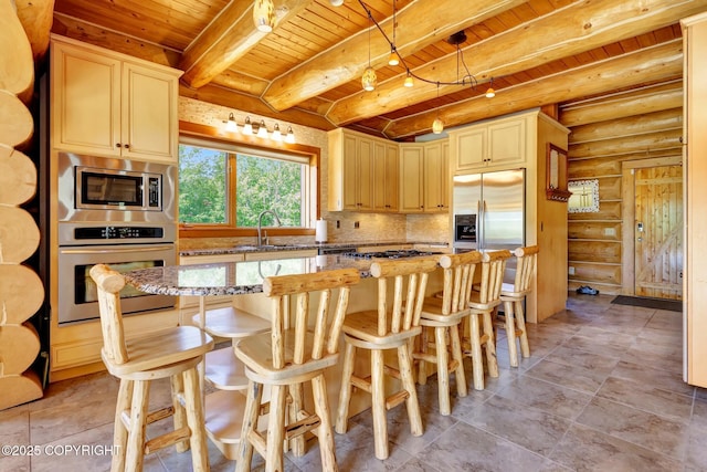 3108 Misty Mountain Rd, Eagle River, AK 99577 - kitchen featuring built in appliances, a wooden ceiling with exposed beams, rustic walls, light stone counters, and a center island
