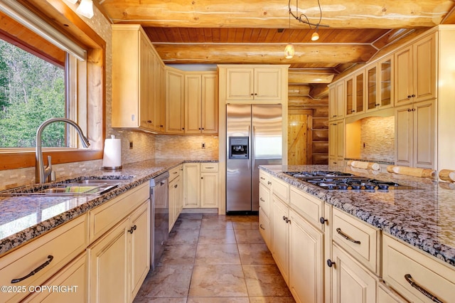 3108 Misty Mountain Rd, Eagle River, AK 99577 - kitchen with appliances with stainless steel finishes, a wooden ceiling with exposed beams, log walls, light stone counters, and backsplash