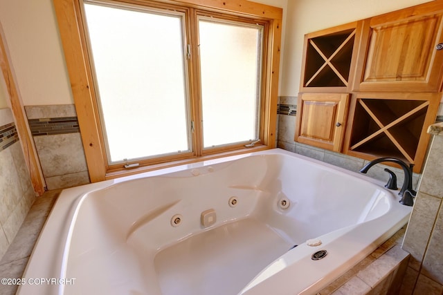 3108 Misty Mountain Rd, Eagle River, AK 99577 - bathroom with a whirlpool tub and tile walls