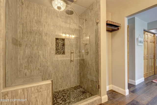 3108 Misty Mountain Rd, Eagle River, AK 99577 - bathroom featuring a shower stall and wood finished floors