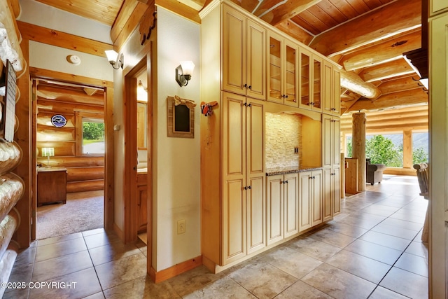 3108 Misty Mountain Rd, Eagle River, AK 99577 - hallway featuring rustic walls, light tile patterned flooring, and a wooden ceiling with exposed beams