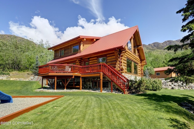 3108 Misty Mountain Rd, Eagle River, AK 99577 - back of property with stairway, a deck with mountain view, a lawn, log siding, and a metal roof
